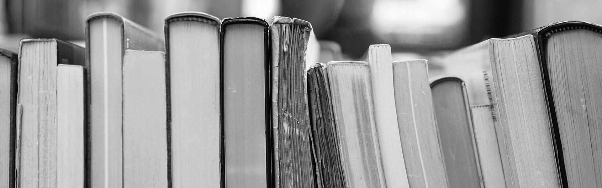 black & white picture of books on a shelf